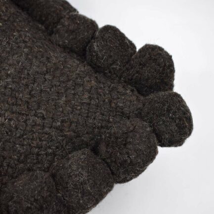 Coussin à pompons noir 30x60