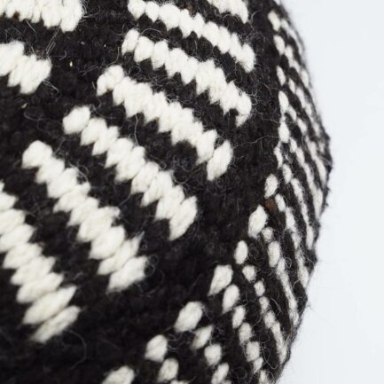 Coussin rond à motifs noir