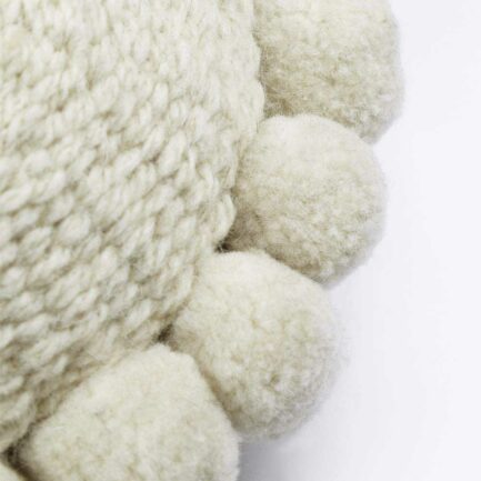 Mini coussin rond à pompons blanc