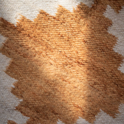 Mini tapis en laine ocre